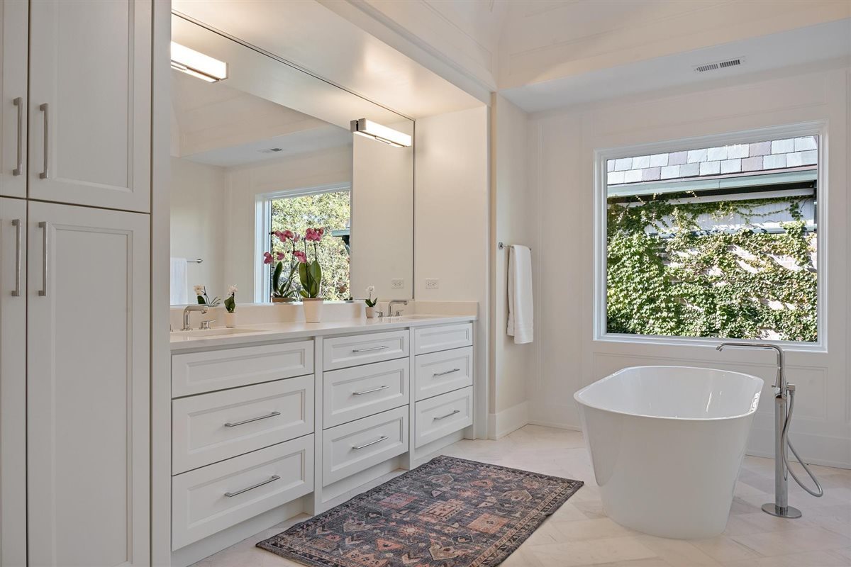 889 Cherry Street Winnetka, IL 60093 - Photo 31 of 76 a bathroom with a granite countertop sink and a mirror