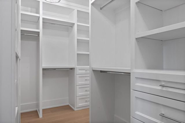 a large room with windows and closet