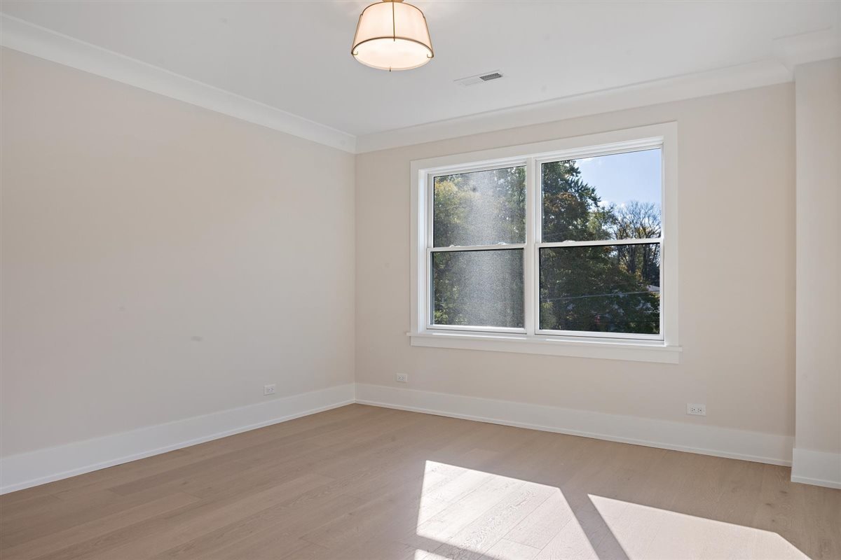 889 Cherry Street Winnetka, IL 60093 - Photo 36 of 76 an empty room with a window