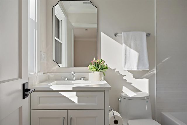 a bathroom with a shower and a glass door