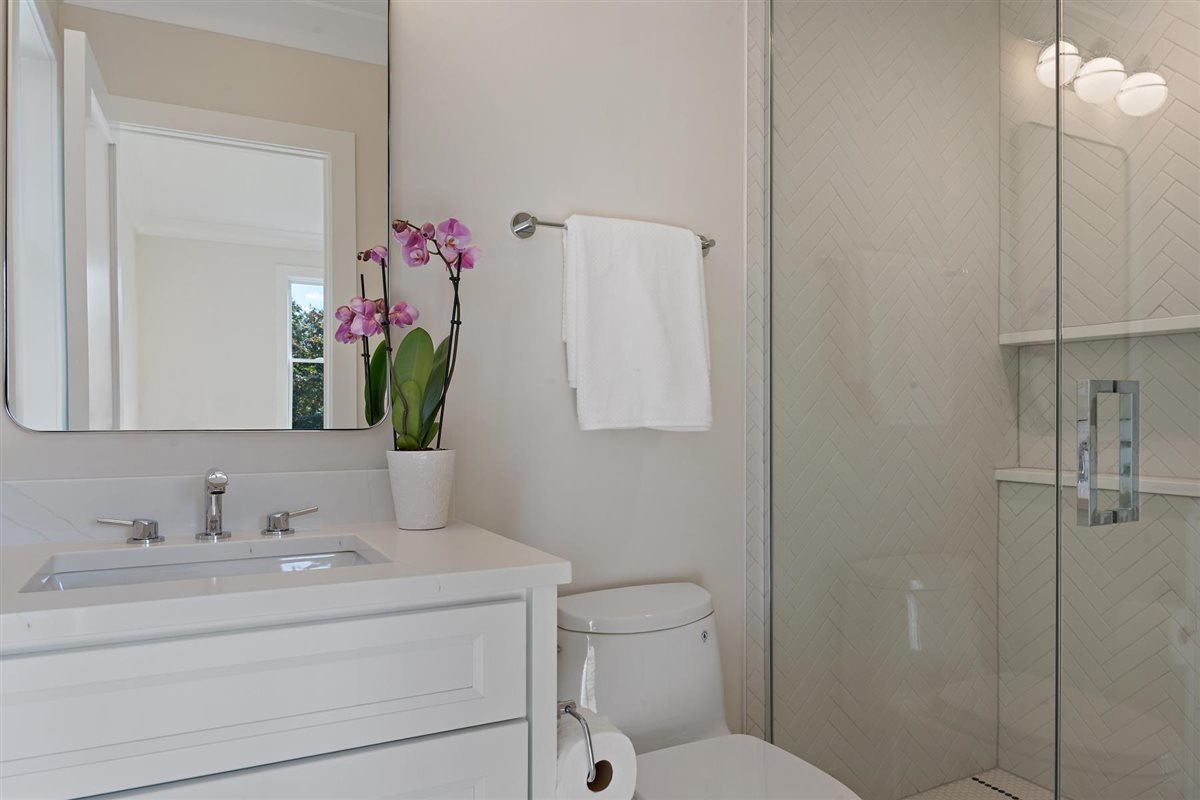 889 Cherry Street Winnetka, IL 60093 - Photo 40 of 76 a bathroom with a sink vanity mirror and toilet