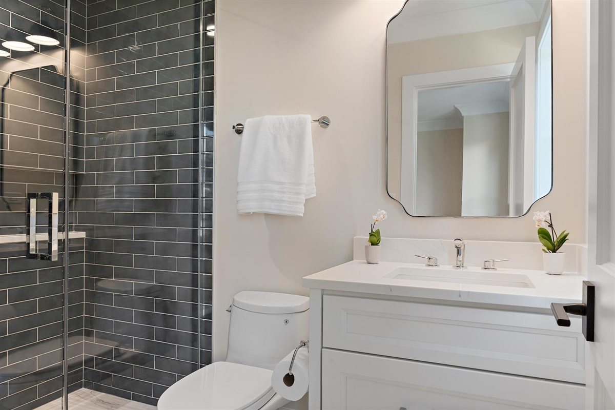 889 Cherry Street Winnetka, IL 60093 - Photo 42 of 76 a bathroom with a toilet sink vanity and mirror