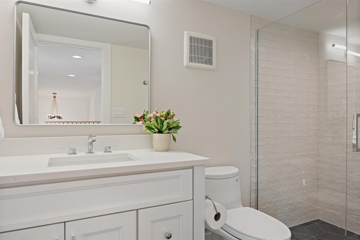 889 Cherry Street Winnetka, IL 60093 - Photo 50 of 76 a bathroom with a sink toilet and a mirror