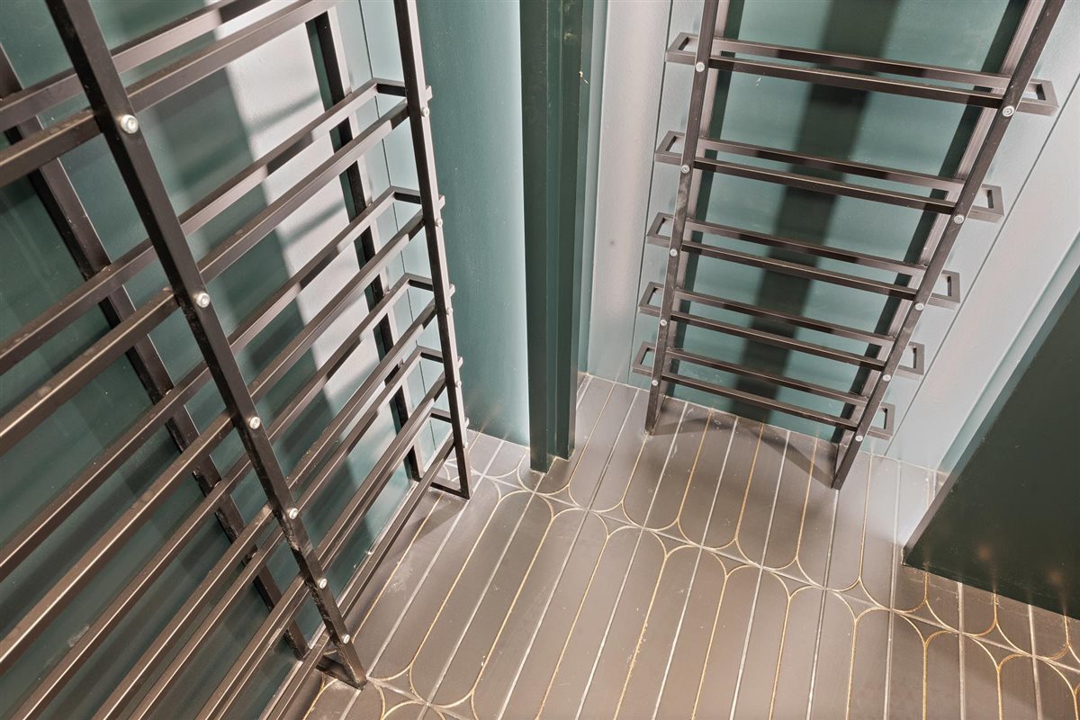 889 Cherry Street Winnetka, IL 60093 - Photo 61 of 76 a view of an empty room with wooden floor and stairs