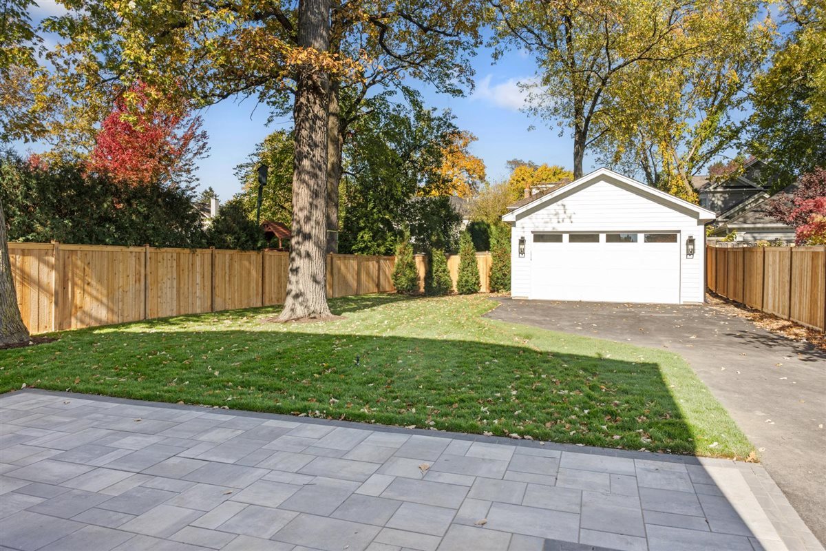 889 Cherry Street Winnetka, IL 60093 - Photo 67 of 76 a front view of a house with garden