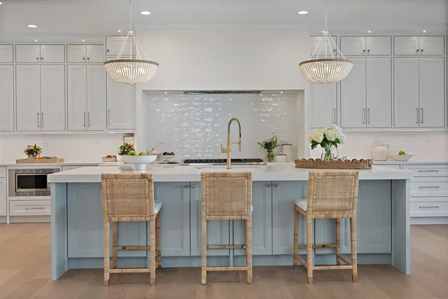 a kitchen with stainless steel appliances granite countertop a sink and a granite counter tops