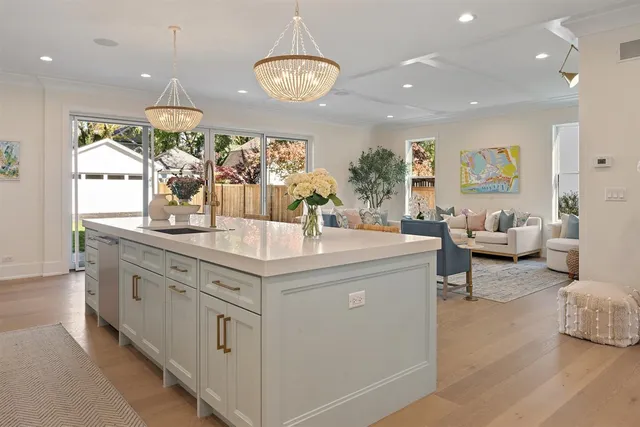 a view of living room with furniture and flowers