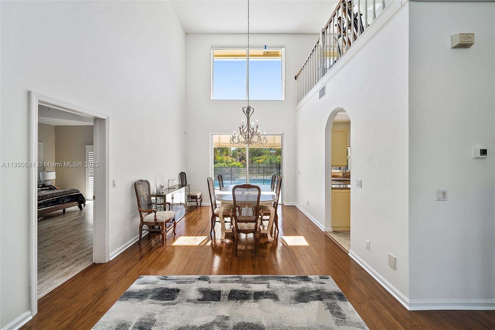 32 Coconut Lane Tequesta, FL 33469 - Photo 11 of 56 a view of a dining room with furniture window and wooden floor