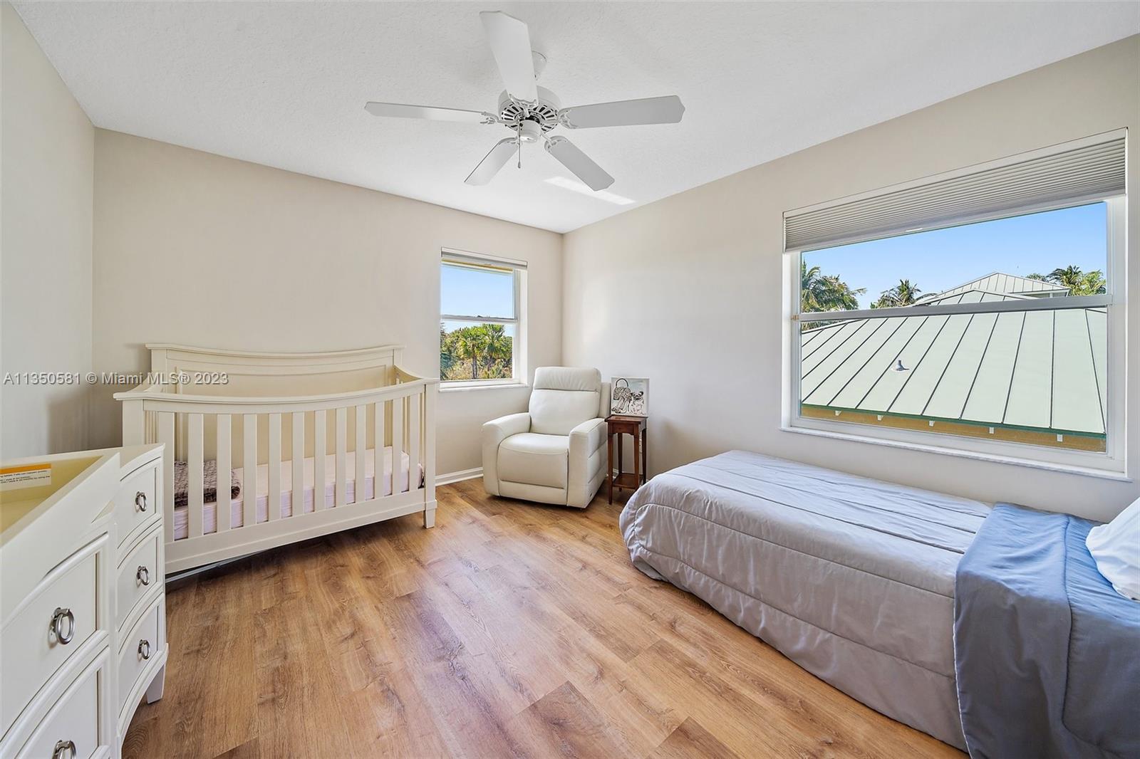 32 Coconut Lane Tequesta, FL 33469 - Photo 32 of 56 a bedroom with two beds and a window