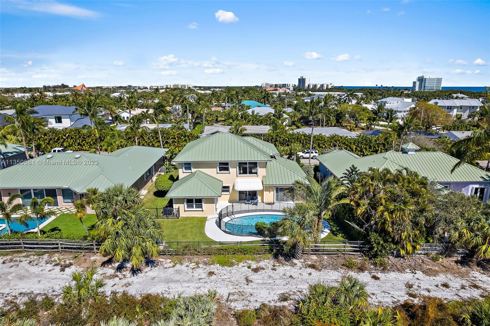 32 Coconut Lane Tequesta, FL 33469 - Photo 4 of 56 an aerial view of a house with a yard