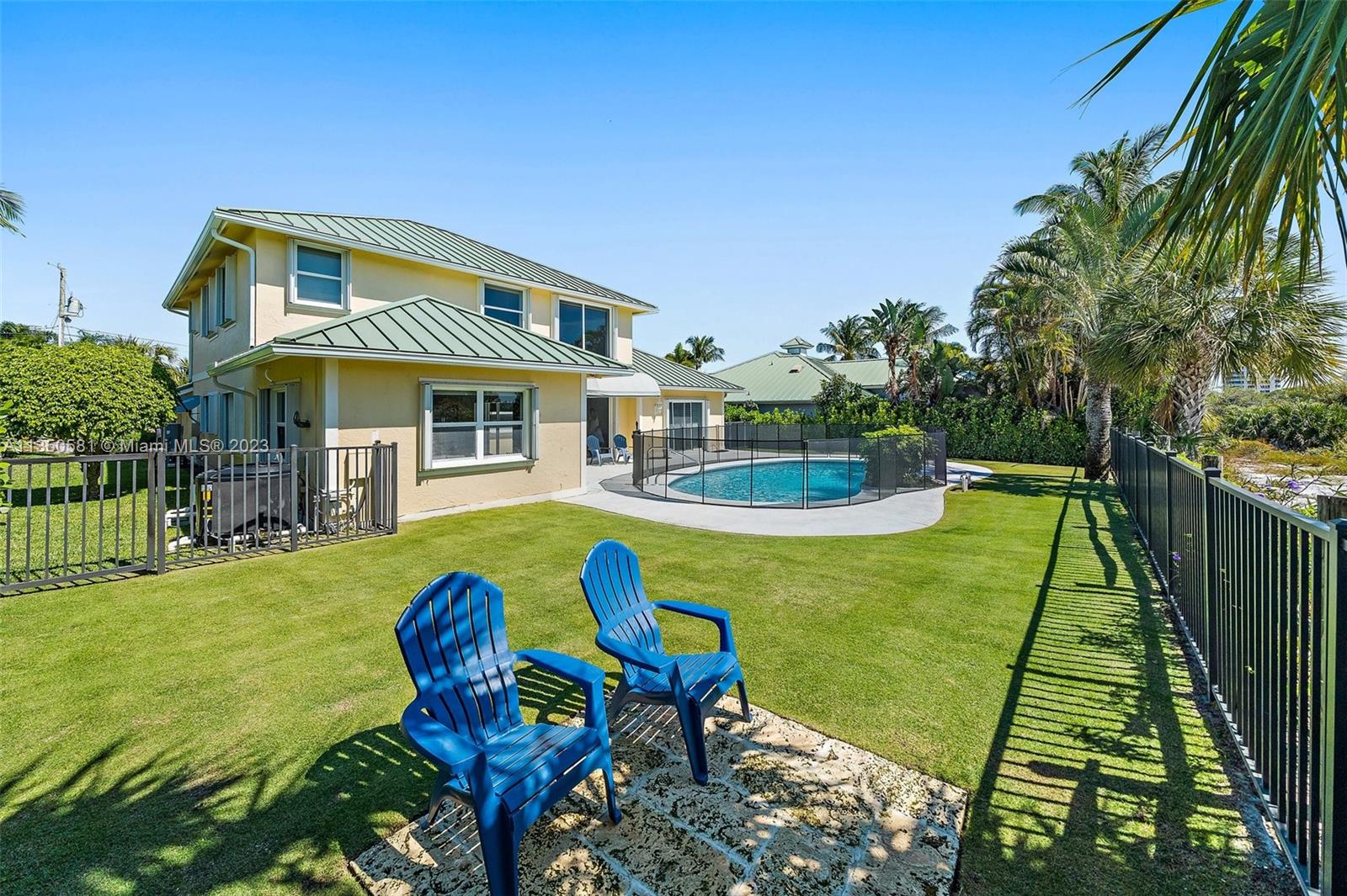 32 Coconut Lane Tequesta, FL 33469 - Photo 47 of 56 a view of a house with backyard and sitting area