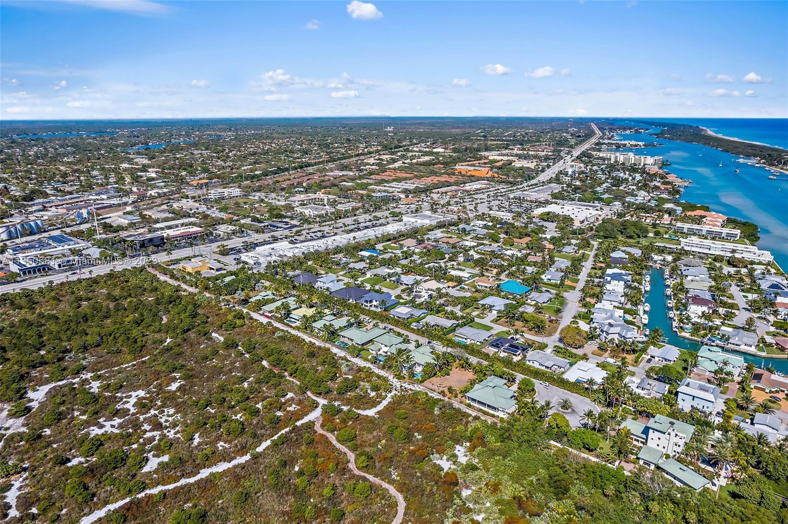 32 Coconut Lane Tequesta, FL 33469 - Photo 54 of 56 an aerial view of a residential houses with city view