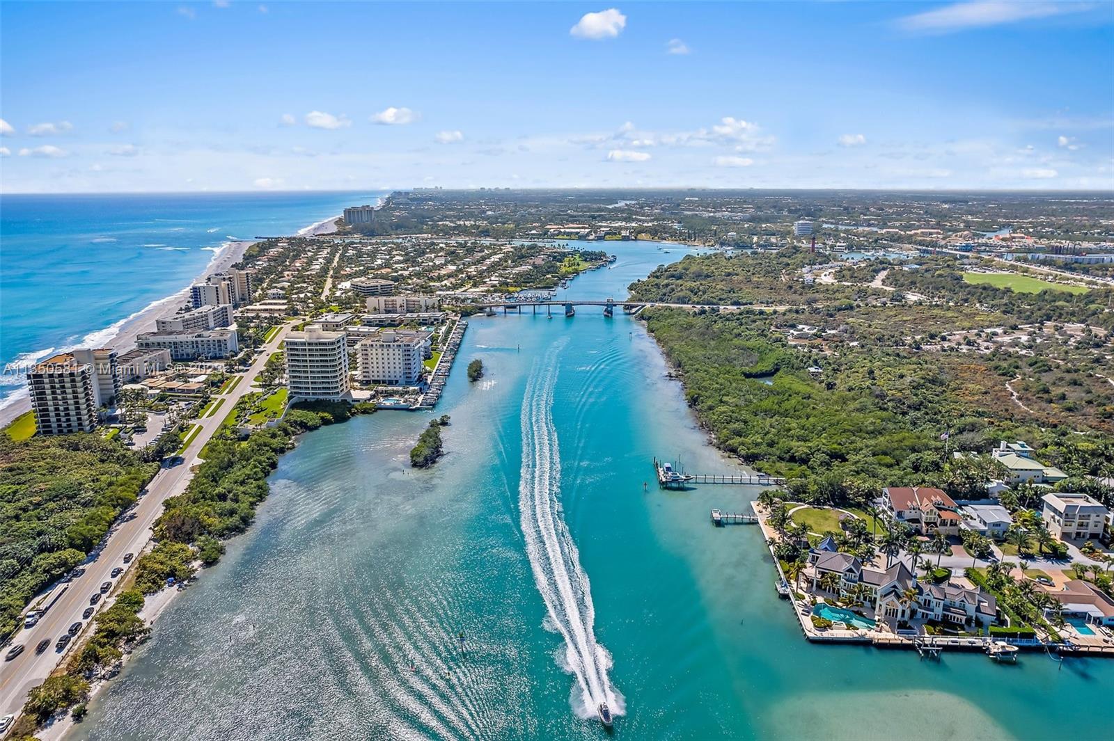 32 Coconut Lane Tequesta, FL 33469 - Photo 56 of 56 an aerial view of a house with a garden