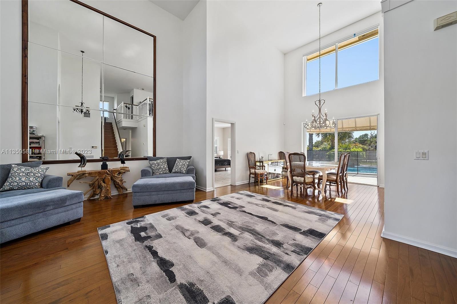 32 Coconut Lane Tequesta, FL 33469 - Photo 10 of 56 a bedroom with furniture and wooden floor