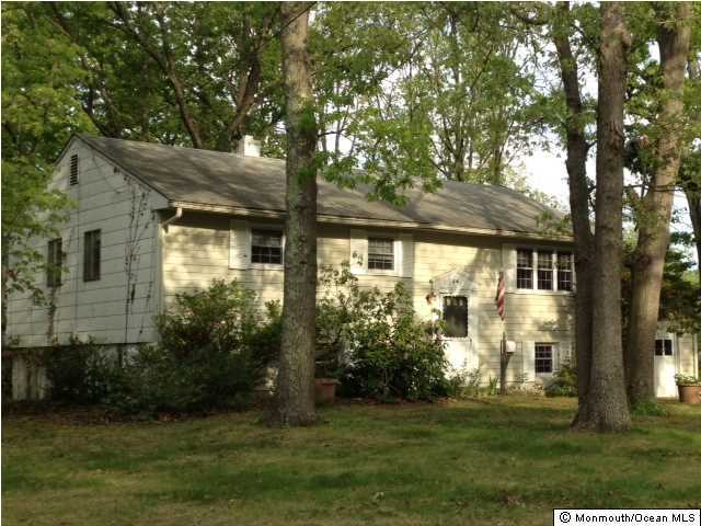 24 Darien Road Howell, NJ 07731 - Photo 1 of 1 a front view of a house with a yard