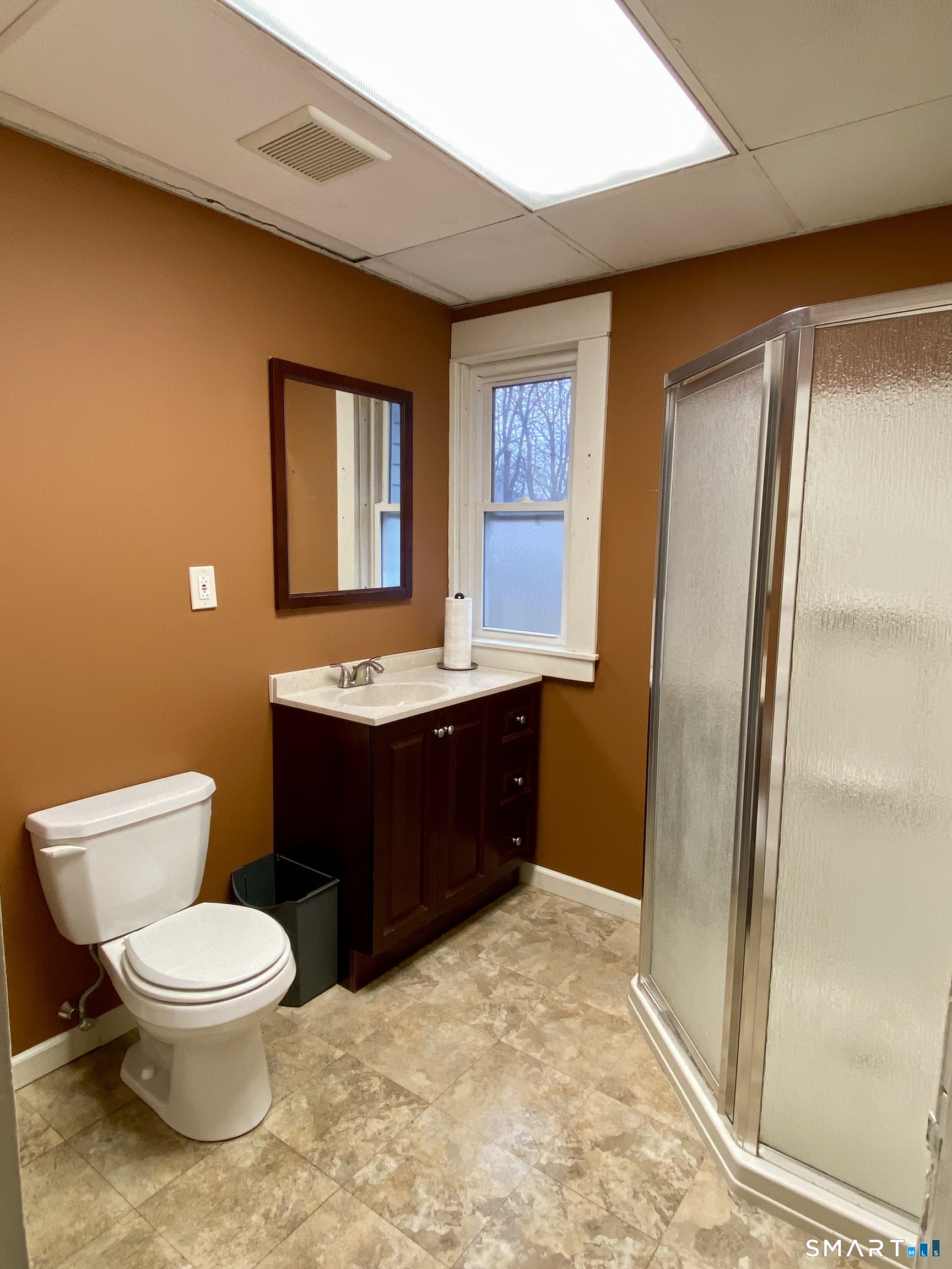 140 Union Street Vernon, CT 06066 - Photo 16 of 26 a bathroom with a granite countertop sink toilet and shower