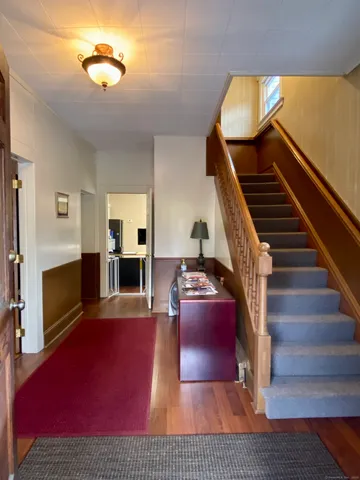 a view of livingroom with furniture fireplace and wooden floor