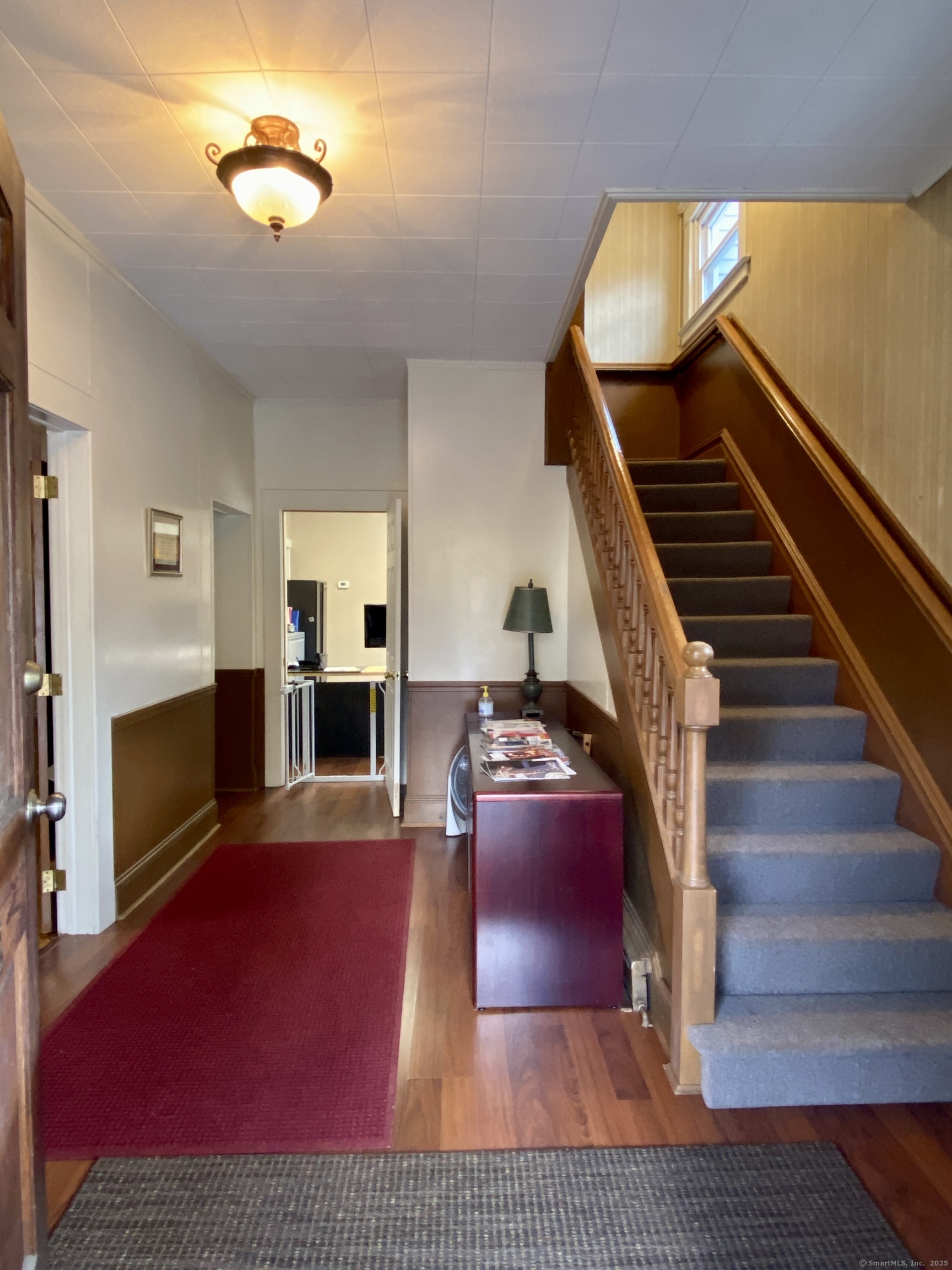 140 Union Street Vernon, CT 06066 - Photo 5 of 26 a view of livingroom with furniture fireplace and wooden floor
