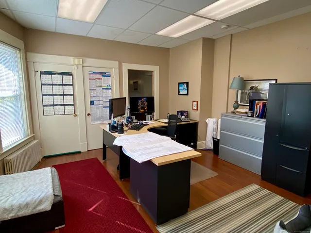 a room with furniture and a rug