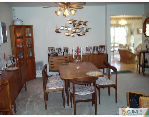 4201 Springbrook Drive Edison, NJ 08820 - Photo 3 of 8 a view of a dining room with furniture