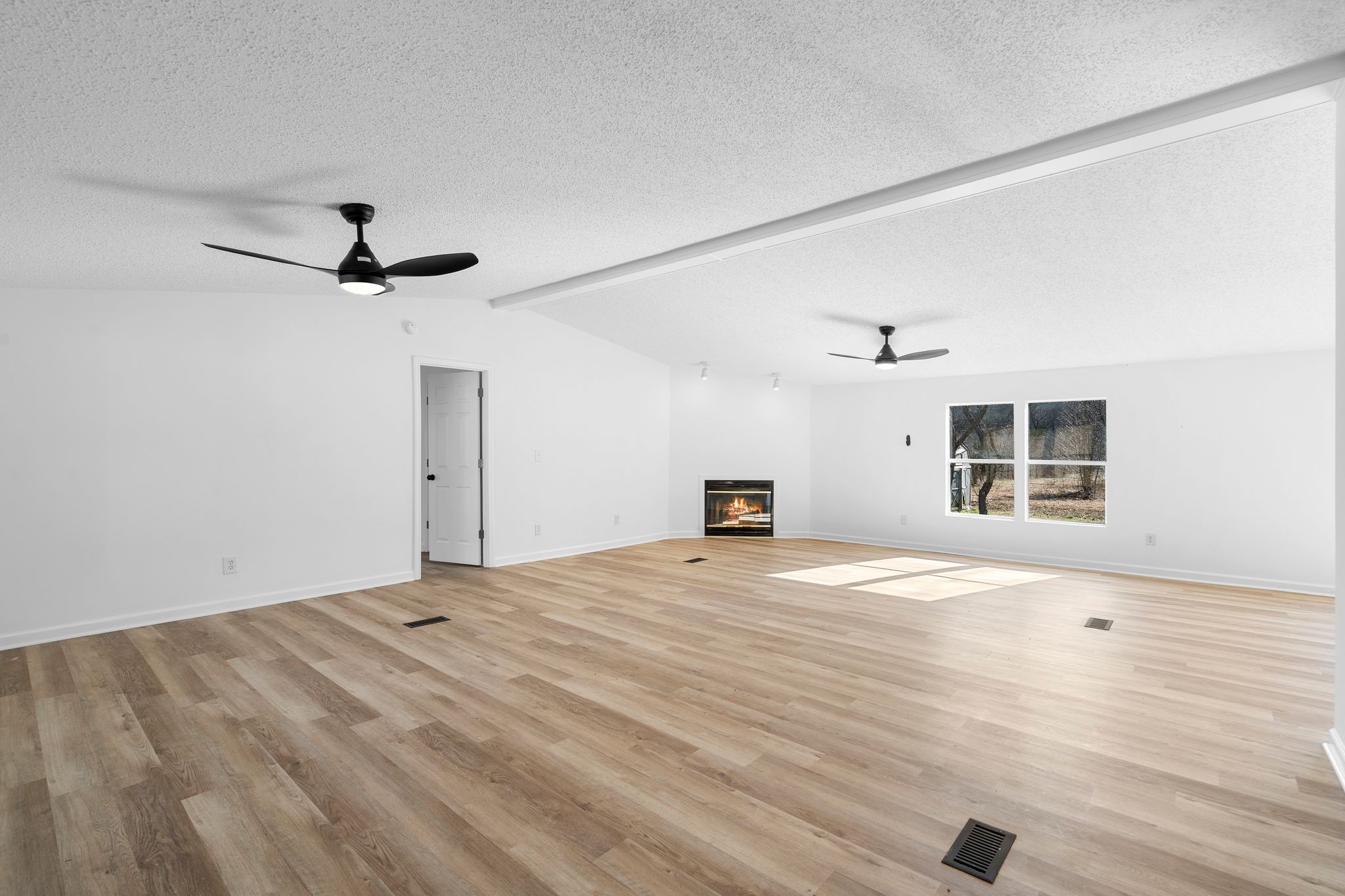 3092 McKibbon Road Culleoka, TN 38451 - Photo 17 of 41 a view of empty room with wooden floor and fan