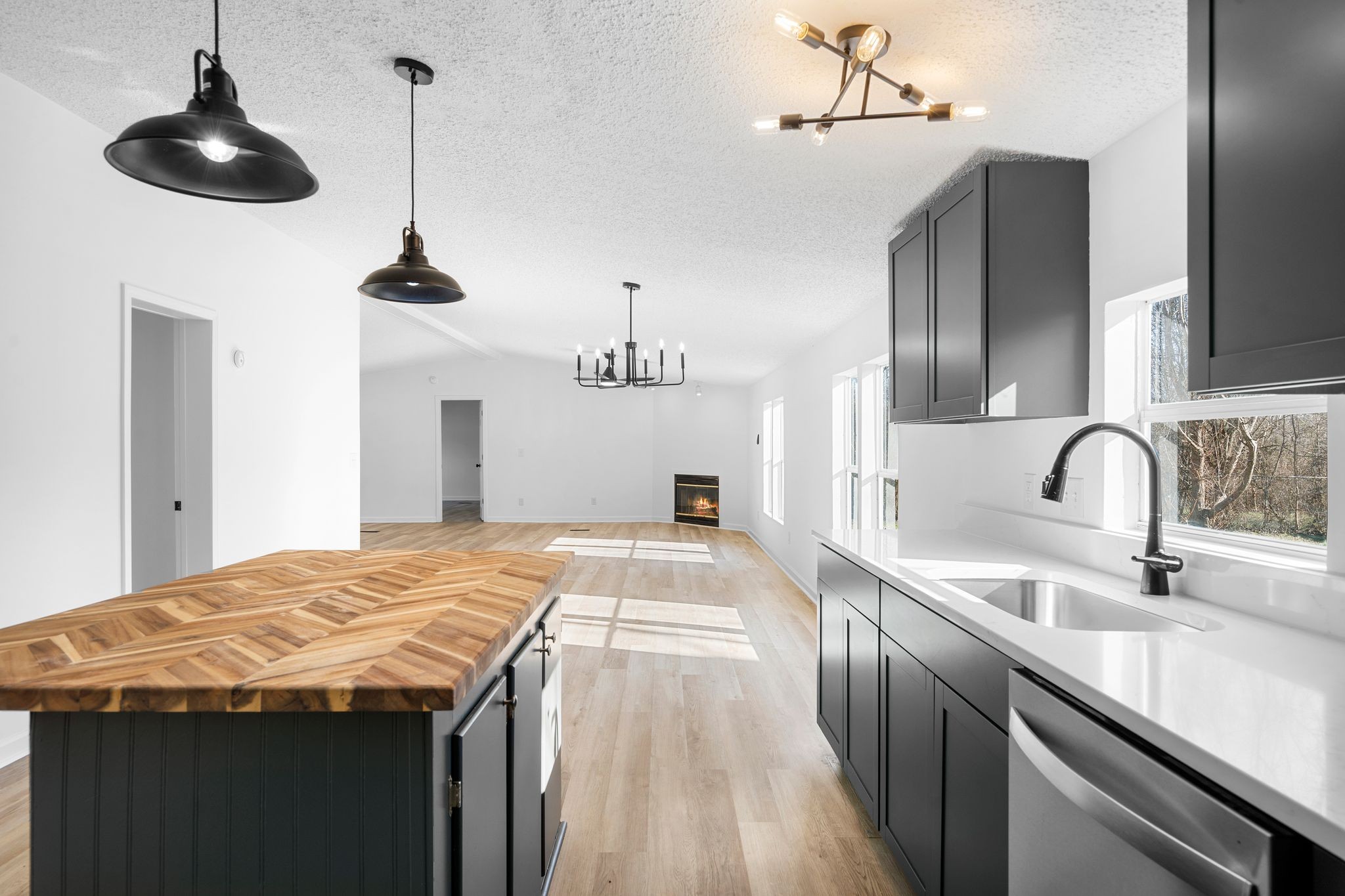 3092 McKibbon Road Culleoka, TN 38451 - Photo 21 of 41 a kitchen with stainless steel appliances kitchen island granite countertop a sink a stove and a wooden floors