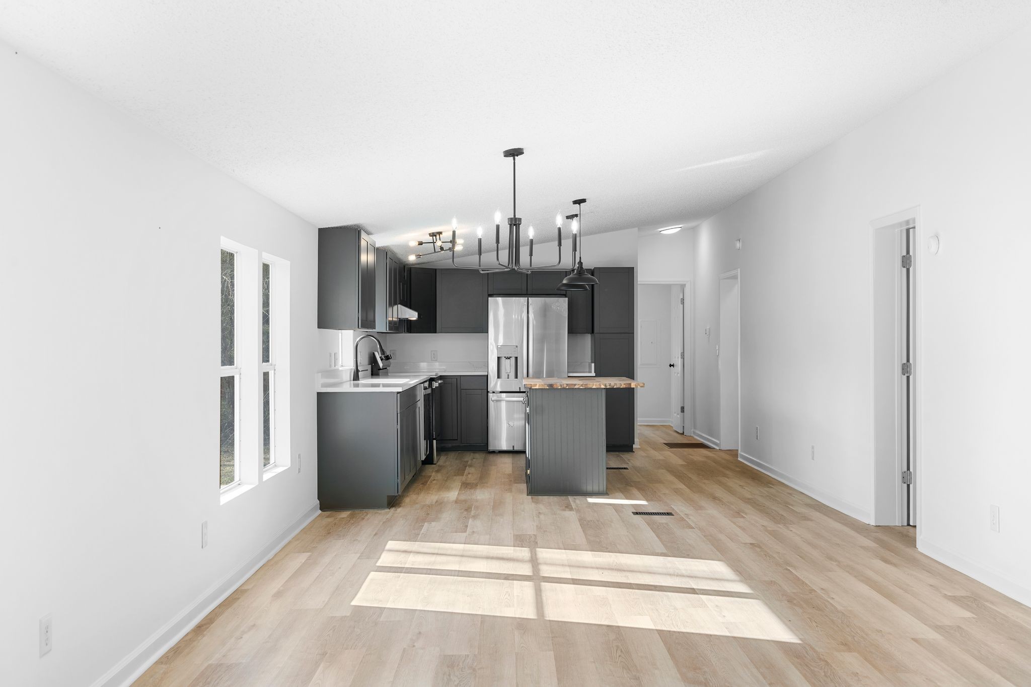 3092 McKibbon Road Culleoka, TN 38451 - Photo 24 of 41 a view of a kitchen with a sink dishwasher a refrigerator and cabinets