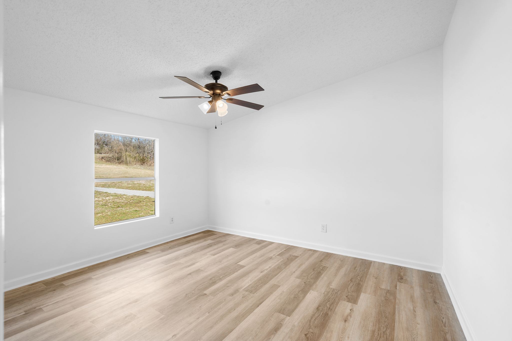 3092 McKibbon Road Culleoka, TN 38451 - Photo 37 of 41 an empty room with a window and a fan