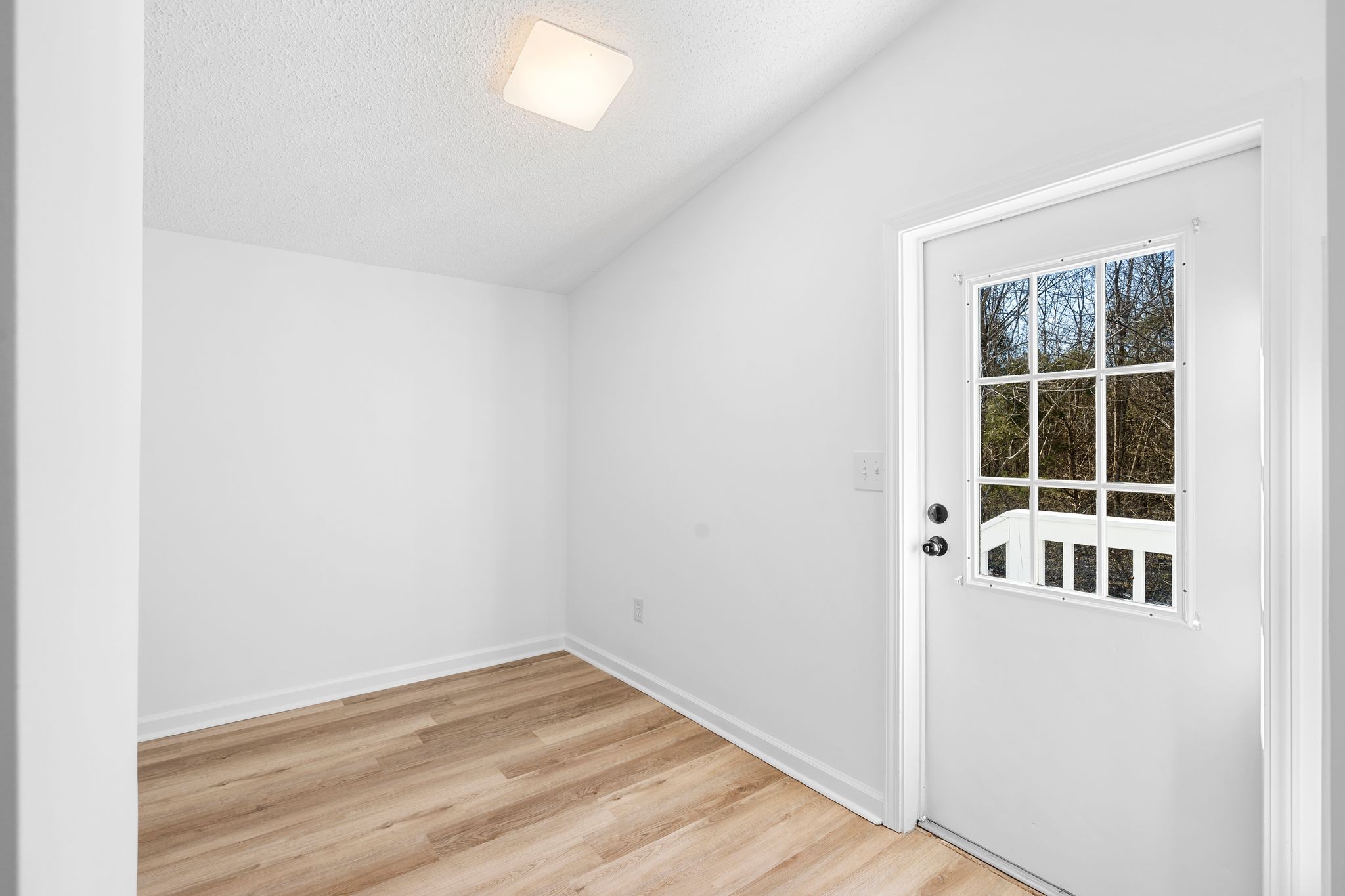 3092 McKibbon Road Culleoka, TN 38451 - Photo 39 of 41 a view of empty room with wooden floor and fan