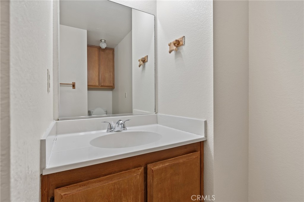 23561 Short Way Crestline, CA 92325 - Photo 13 of 18 a bathroom with a sink and a mirror
