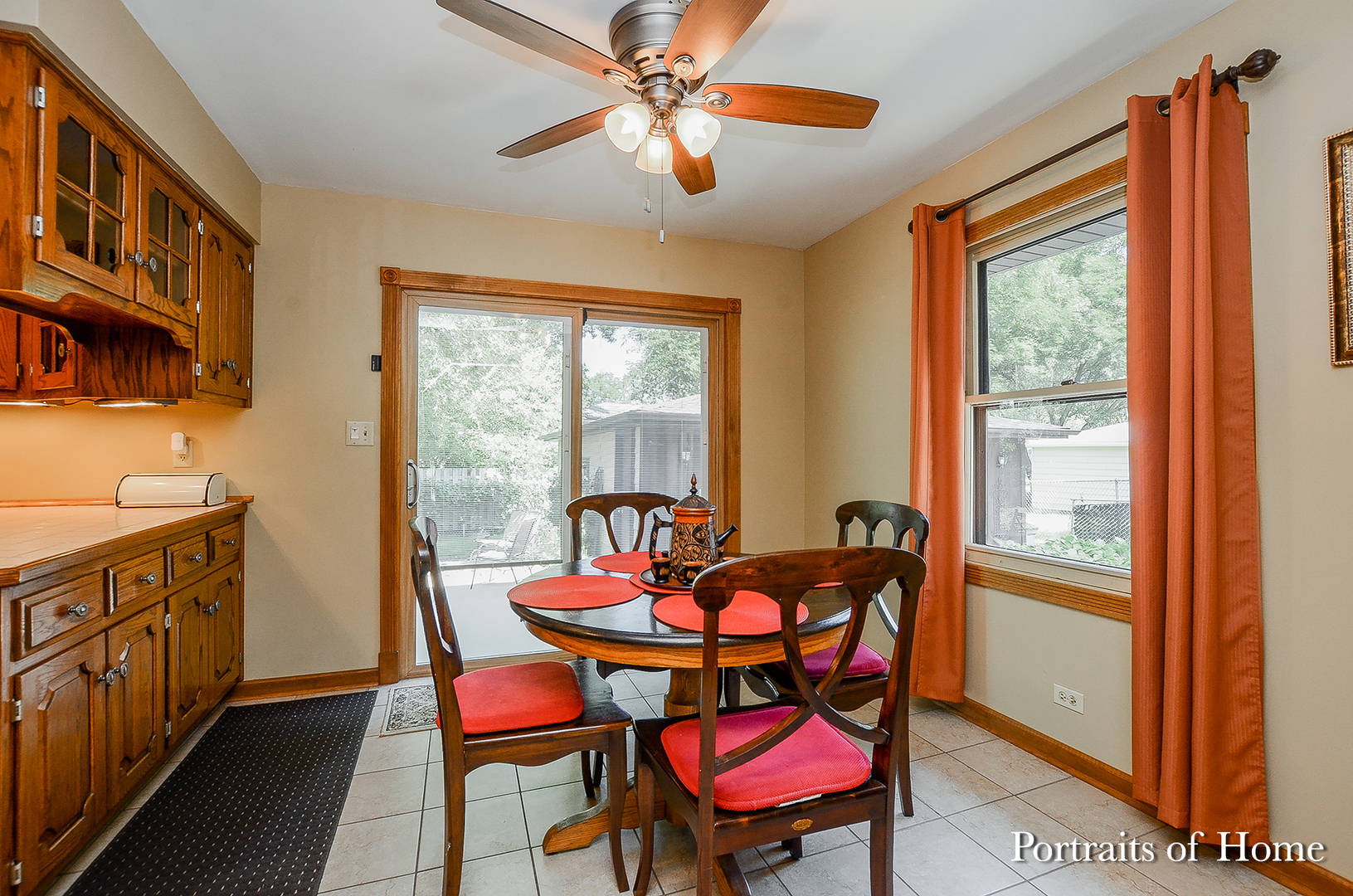 1805 South Tyler Road St. Charles, IL 60174 - Photo 3 of 17 a dining room with furniture a rug and a chandelier