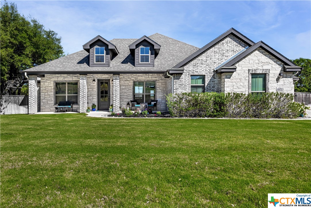4051 Fossil Ridge Drive Nolanville, TX 76559 - Photo 1 of 1 a front view of a house with a yard