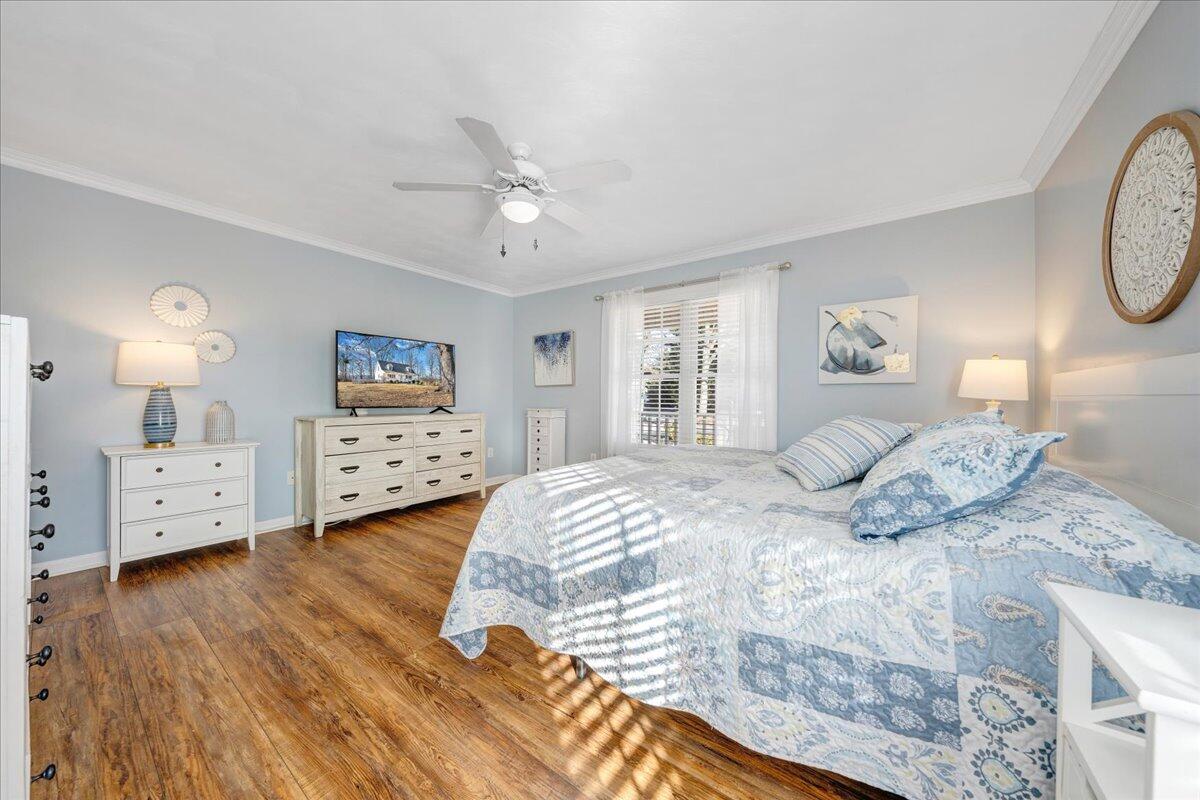 2695 Hardy Road Hardy, VA 24101 - Photo 14 of 36 a bedroom with a bed and a chandelier