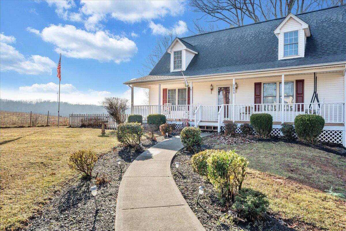 2695 Hardy Road Hardy, VA 24101 - Photo 2 of 36 a front view of a house with garden