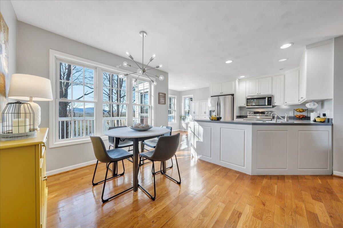 2695 Hardy Road Hardy, VA 24101 - Photo 6 of 36 a kitchen with stainless steel appliances granite countertop a kitchen island a stove a table and chairs