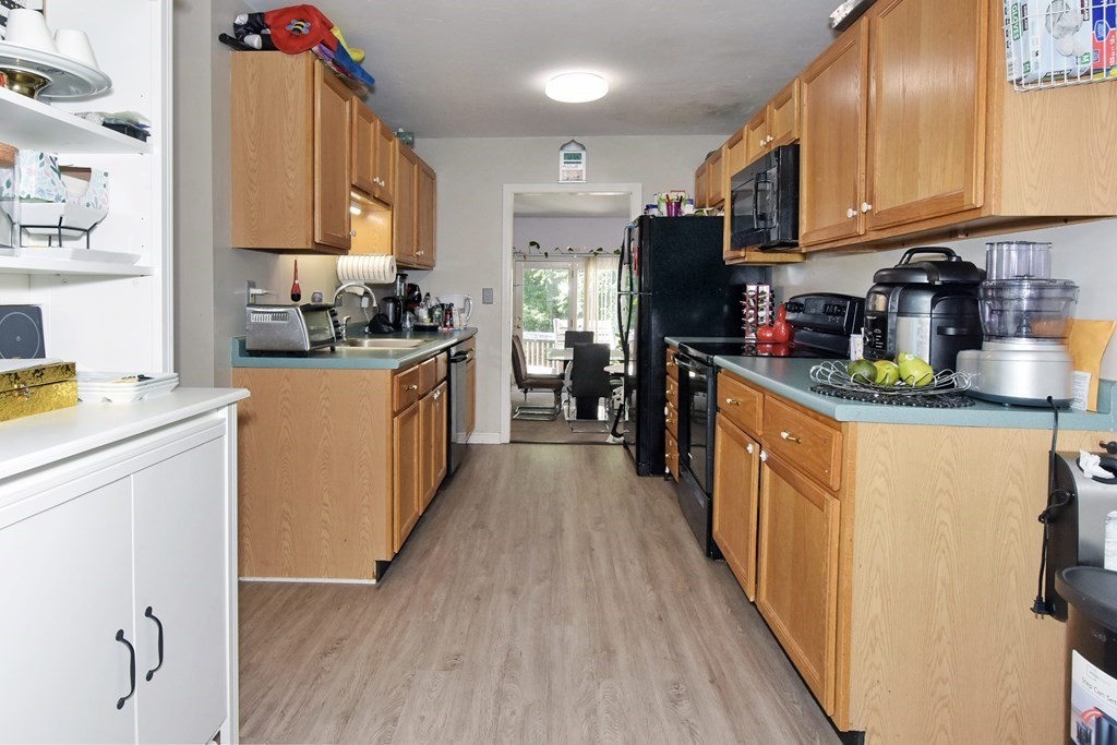 17 Highfield Road, Unit C Charlton, MA 01507 - Photo 4 of 31 a kitchen with granite countertop lots of counter top space and stainless steel appliances