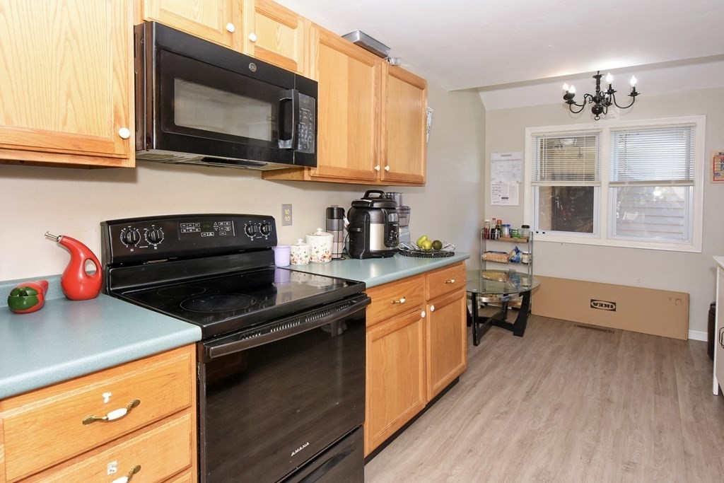 17 Highfield Road, Unit C Charlton, MA 01507 - Photo 5 of 31 a kitchen with stainless steel appliances granite countertop a stove a sink and a microwave