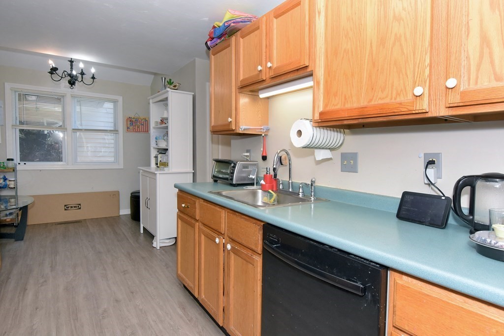 17 Highfield Road, Unit C Charlton, MA 01507 - Photo 7 of 31 a kitchen with stainless steel appliances granite countertop a sink a stove and cabinets