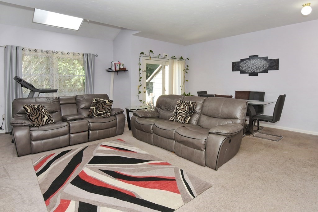 17 Highfield Road, Unit C Charlton, MA 01507 - Photo 8 of 31 a living room with furniture and a large window
