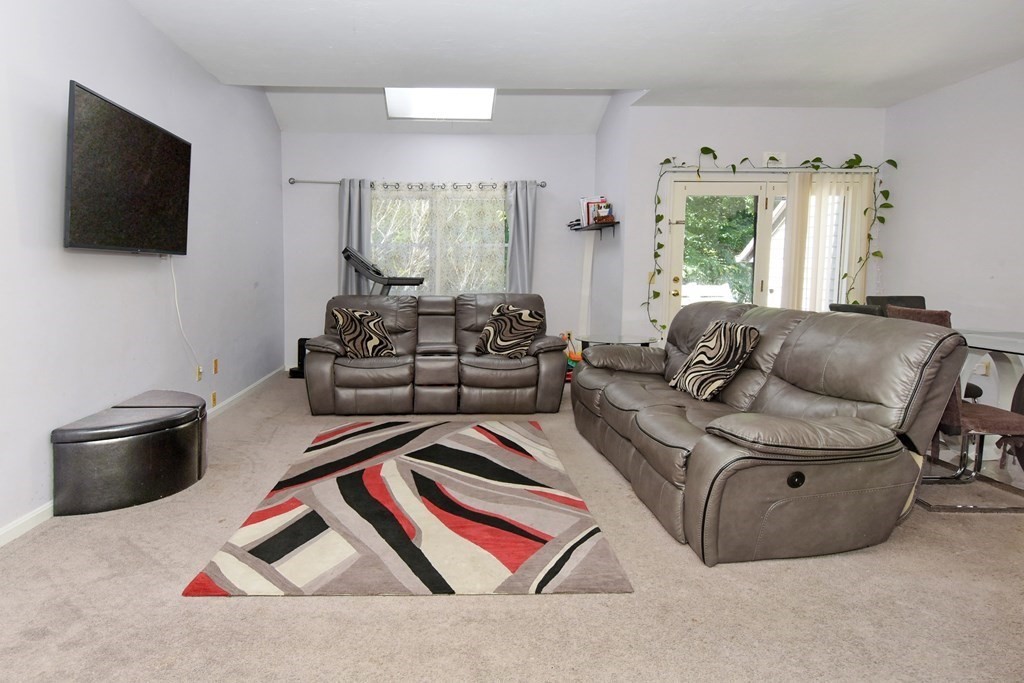 17 Highfield Road, Unit C Charlton, MA 01507 - Photo 9 of 31 a living room with furniture and a flat screen tv