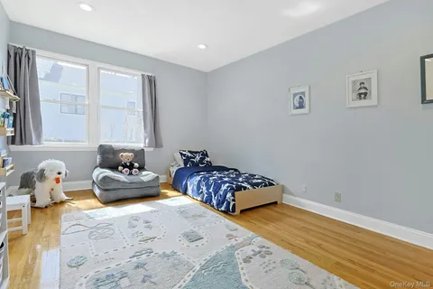 a bedroom with furniture and a window