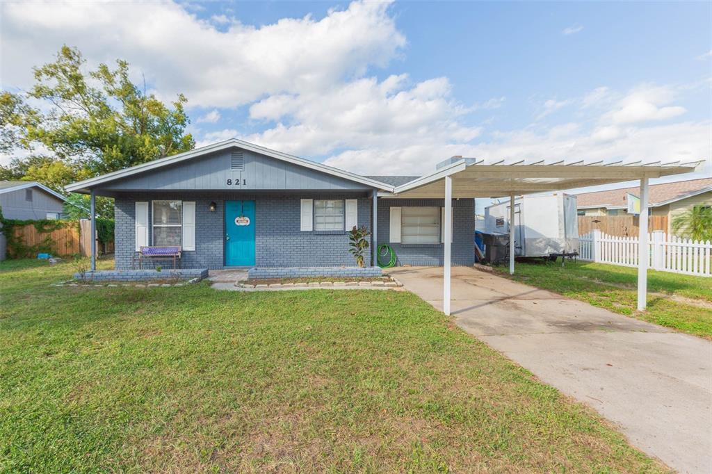 821 Walnut Drive Seffner, FL 33584 - Photo 1 of 19 a front view of a house with a yard and garage