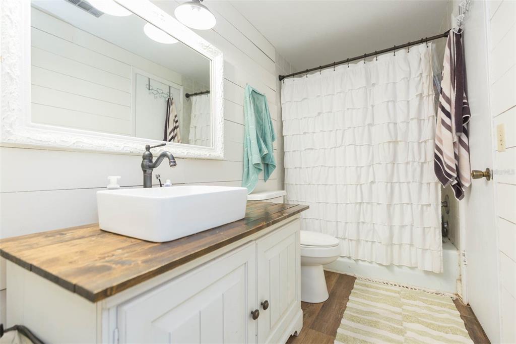 821 Walnut Drive Seffner, FL 33584 - Photo 15 of 19 a bathroom with a sink a toilet and shower