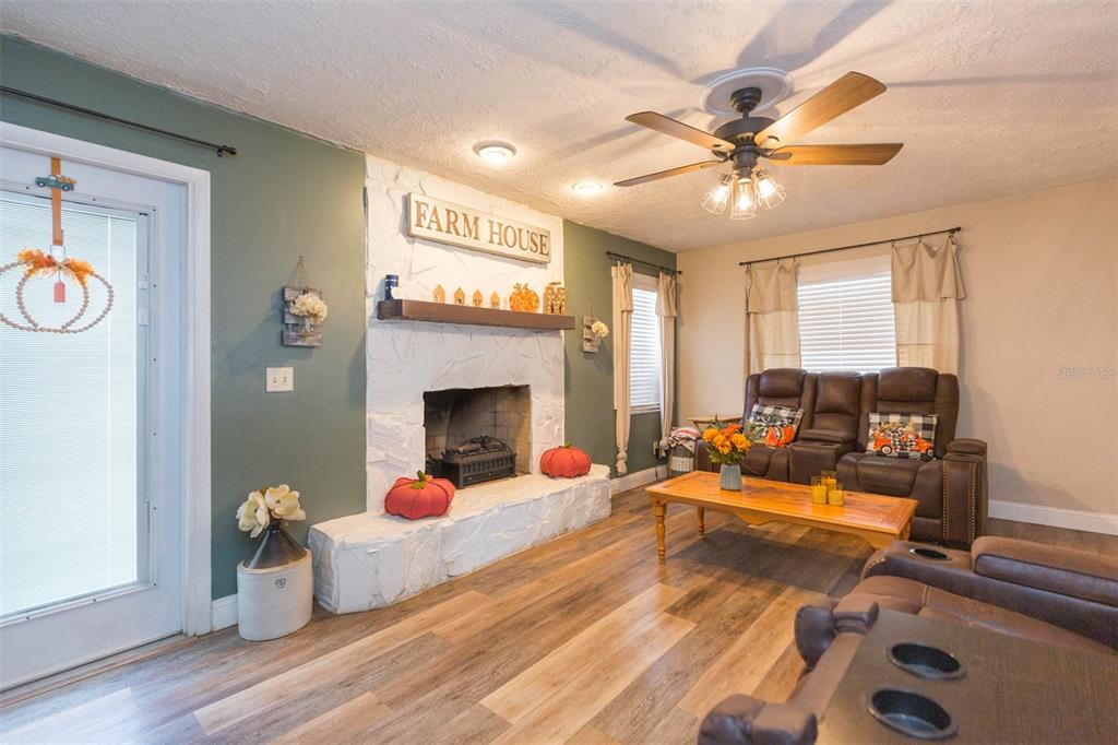 821 Walnut Drive Seffner, FL 33584 - Photo 2 of 19 a living room with furniture and a fireplace