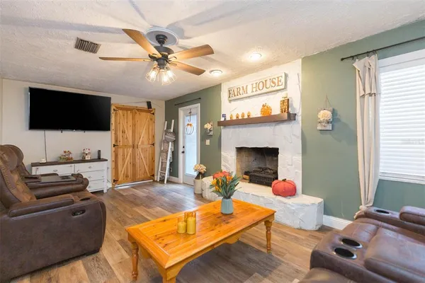 a living room with furniture and a flat screen tv