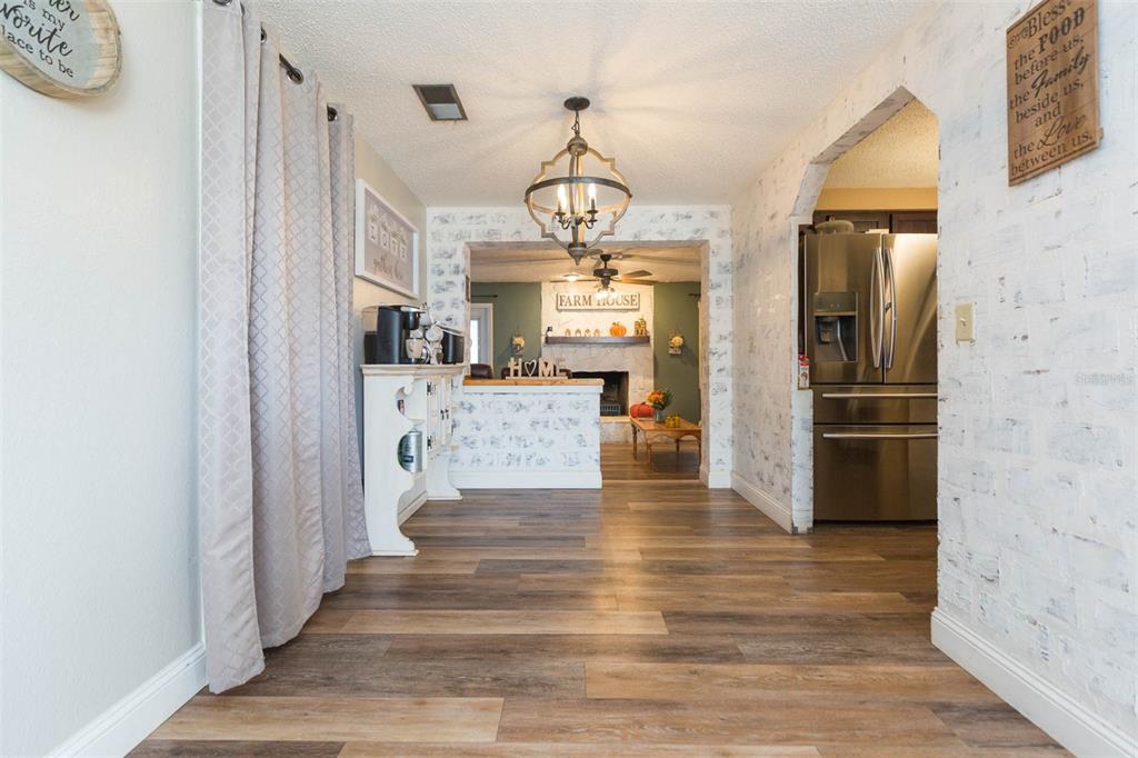 821 Walnut Drive Seffner, FL 33584 - Photo 6 of 19 a view of a hallway view with wooden floor and staircase