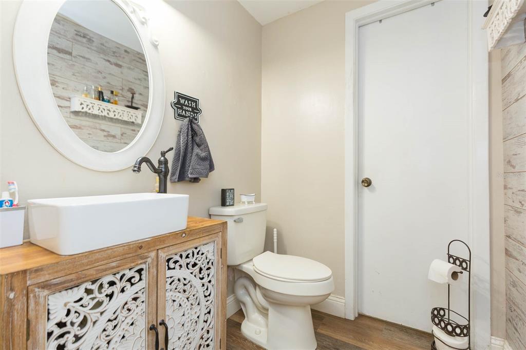 821 Walnut Drive Seffner, FL 33584 - Photo 10 of 19 a bathroom with a toilet a sink and a mirror