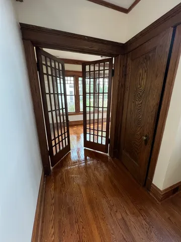a view of entryway with wooden floor