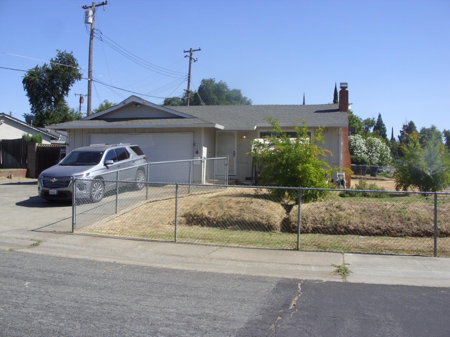 a view of a house with a street