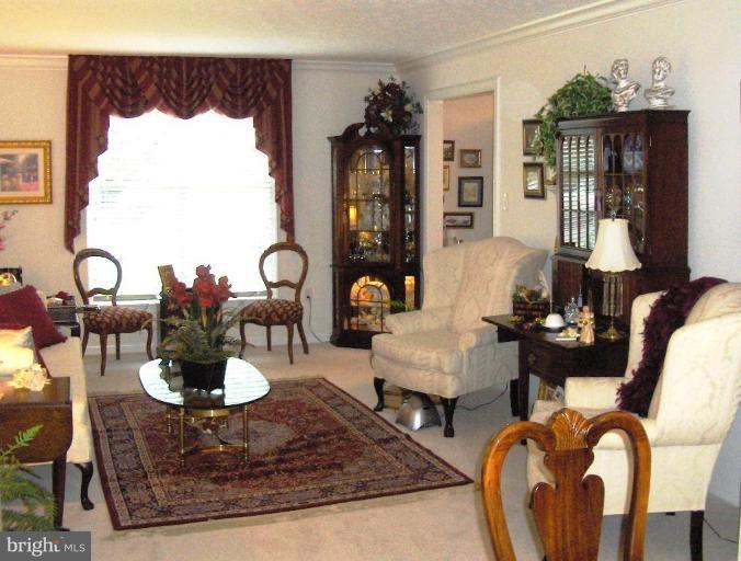 6811 Mallow Court Springfield, VA 22152 - Photo 2 of 30 a living room with furniture